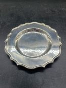 A silver dish with pie crust edge by H Pidduck & Sons, hallmarked for Sheffield 1932.