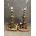 A pair of brass table lamps with marble base