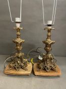 A pair of brass table lamps with marble base