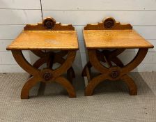 A pair of oak X frame side tables with Tudor rose crest to back