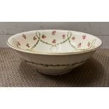 A Victorian wash bowl with rose and swag decoration