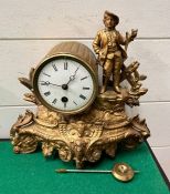 A French mantle clock in gilt with a young man stood on the right AF