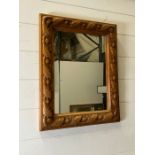 A carved pine mirror (40cm x 50cm)