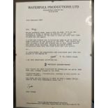 A framed humorous letter from John Cleese to George Gibbs regarding his involvement in the film 'A
