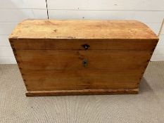 An antique pine trunk with iron metal work handles (H57cm W94cm D52cm)