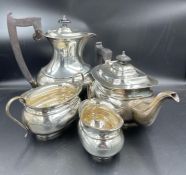 A four piece silver tea set to include teapot, water jug, milk jug and sugar bowl hallmarked for