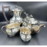 A four piece silver tea set to include teapot, water jug, milk jug and sugar bowl hallmarked for