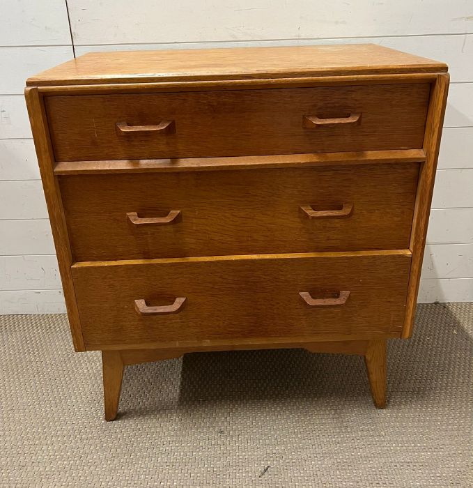 A Mid Century teak chest of drawers (H85cm W76cm D46cm)