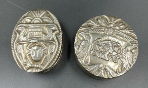 A pair of silver pill boxes