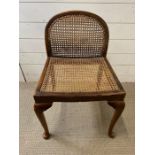 A cane and mahogany side chair