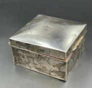 A silver cigarette box, hallmarked for Birmingham 1919 by Williams (Birmingham) Ltd