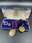 A boxed collection of vintage Rotary medals, badges etc.