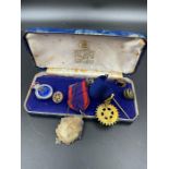 A boxed collection of vintage Rotary medals, badges etc.