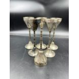 A set of five continental silver (marked 800) glass holders.