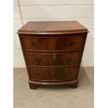 A small three drawer bow fronted chest of drawers (H70cm W56cm D39cm)