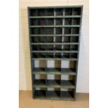 An industrial shelving unit with metal metal pigeon holes (H185cm W92cm D31cm)