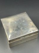 A silver cigarette box, hallmarked for Birmingham 1926.