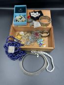 A selection of costume jewellery to include some silver.