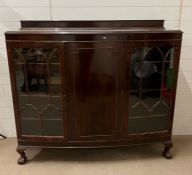 A side cabinet with bow front and glazed doors to side (H127cm W139cm D38cm)