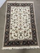 A wool on cotton pattern rug (188cm x 123cm)