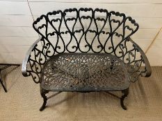 A reclaimed cast iron two seater garden bench with heart scroll detail (H85cm W96cm D42cm)