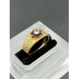 A Bark style 9ct gold ring with diamond and sapphire setting (Total Weight 3.3g) Size O