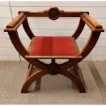 An oak X frame hall chair with Tudor rose crest