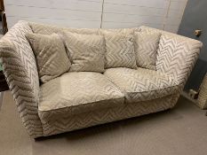 A contemporary two seater sofa (H99cm W205cm D106cm)
