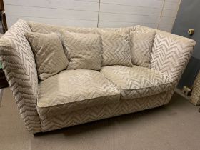 A contemporary two seater sofa (H99cm W205cm D106cm)