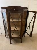 An oak display cabinet with each side opening to lined shelves (H122cm W92c D38cm)