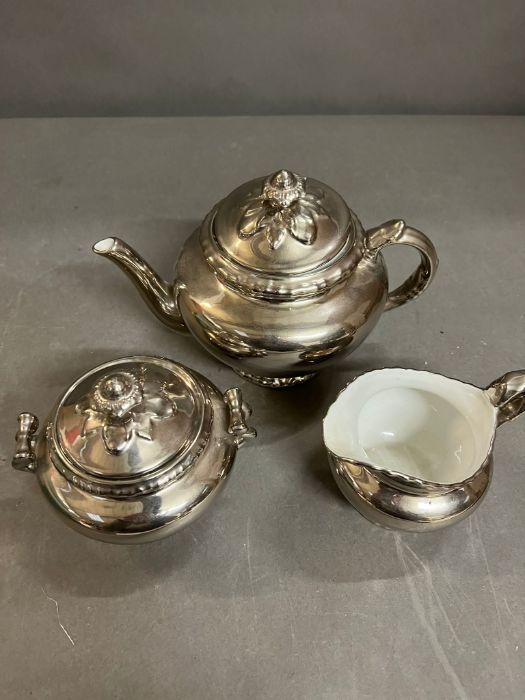 A Royal Worcester silver lustre teapot, sugar bowl and milk jug - Image 4 of 5