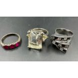 A selection of three silver fashion rings.