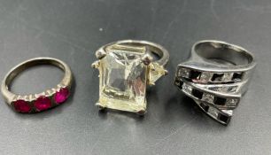 A selection of three silver fashion rings.