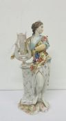 An antique porcelain figure of a classical women with harp AF