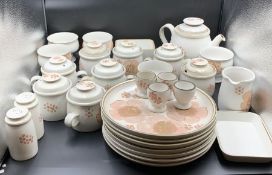 A Denby stoneware dinner service to include seven plates, soup bowls and lidded pots