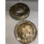 Two copper and brass plates with relief decoration