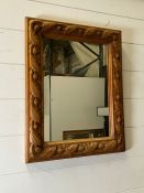 A carved pine mirror (40cm x 50cm)