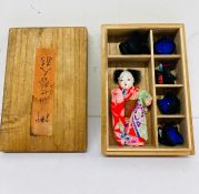Vintage Japan doll in wood box with five wigs