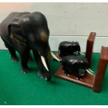 An Ebony elephant and elephant bookends