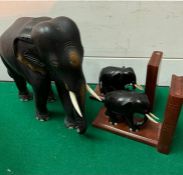 An Ebony elephant and elephant bookends