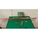 A selection of fishing rods, etc