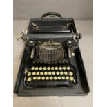 A Vintage Corona typewriter by the J C Smith & Corona Typewriter Inc