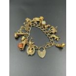 A 9ct gold charm bracelet (Total Weight 43g)