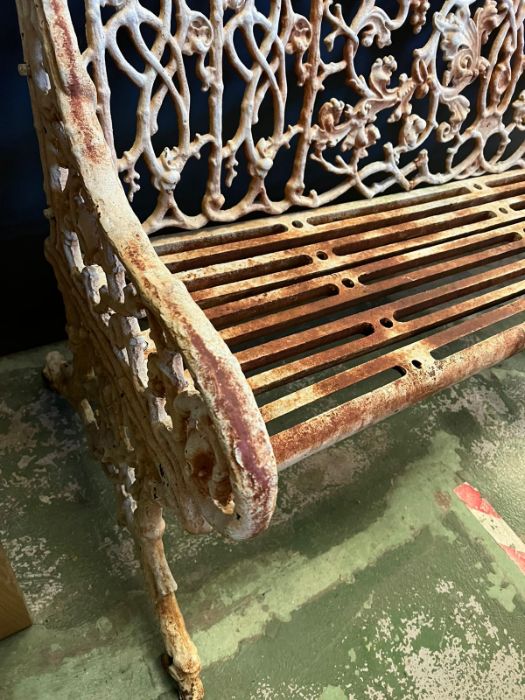 An architectural cast iron bench with vine pattern cast back, scrolling arms and iron slat seats, - Image 3 of 18