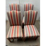 Four upholstered dining chairs with striped fabric