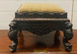 A small oak carved foot stool