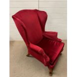 A velvet wing back chair