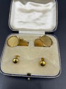 A set of 18ct yellow gold cuff links and two studs (Total Weight 14.1g)