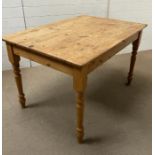 A pine kitchen table (H76cm W122cm D85cm)