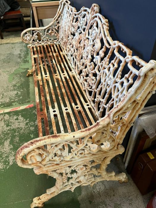 An architectural cast iron bench with vine pattern cast back, scrolling arms and iron slat seats, - Image 4 of 18